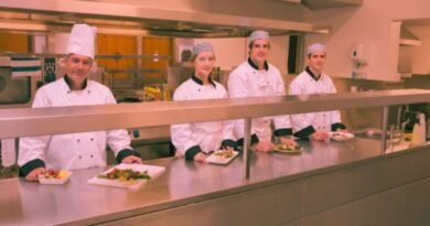 four happy food court attendants at work