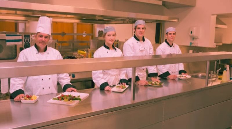 four happy food court attendants at work